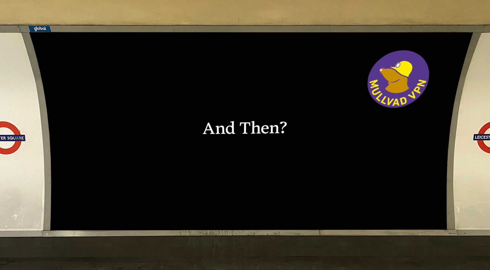 A minimalist Mullvad VPN advertisement on a wall at Leicester Square station in the London Underground. The ad features a solid black background with the white text 'And Then?' centered in the middle. In the top right corner, the purple and yellow Mullvad VPN mole logo is displayed. The red and blue London Underground roundels for Leicester Square are visible on the white walls flanking the advertisement.